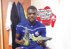 Nigerian midfielder John Ogu shows off new nike boots